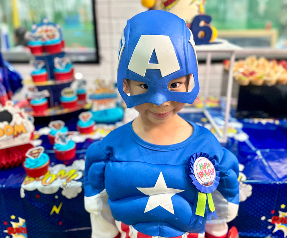Boy dressed as superhero