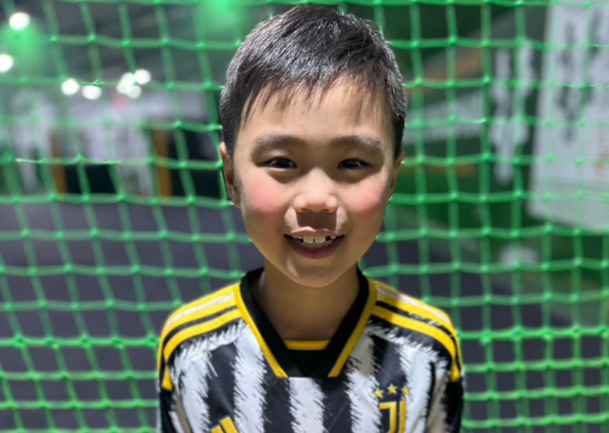 Child at soccer party date